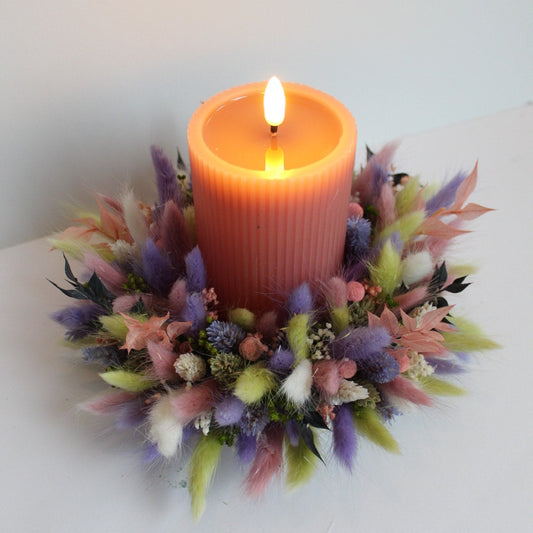 Kaars in bloemstuk