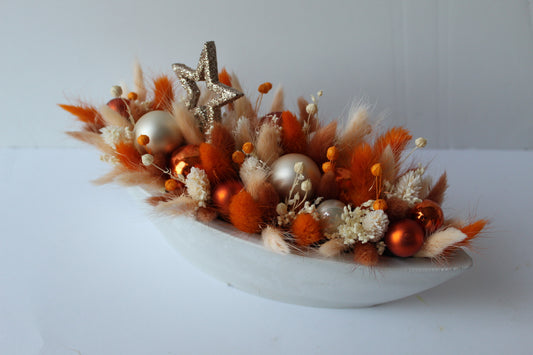 Bloemstuk kerst oranje